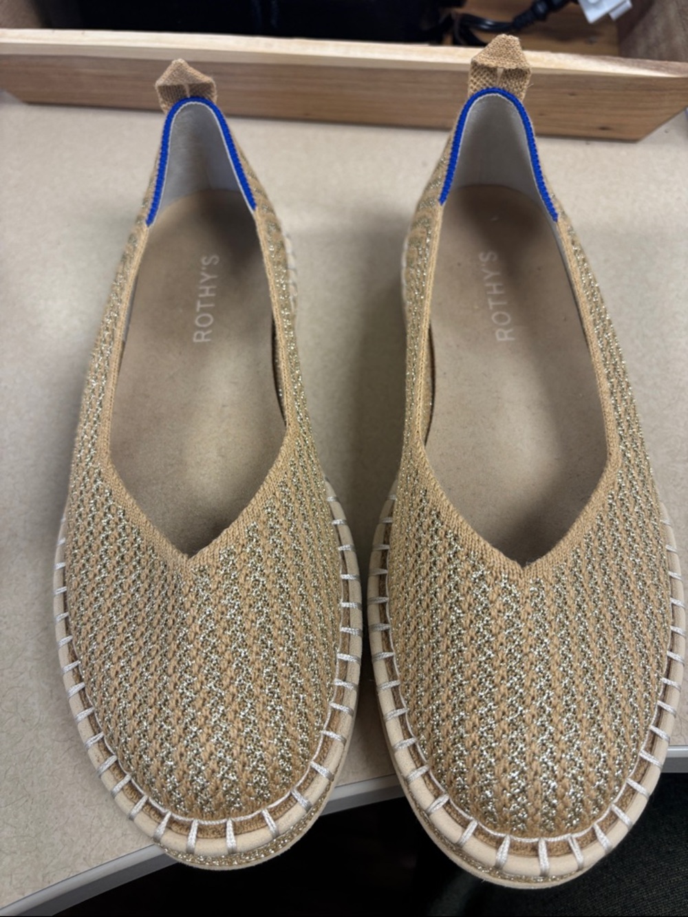 Rothy's Metallic Gold Knit Slip-On Flats with Blue Trim